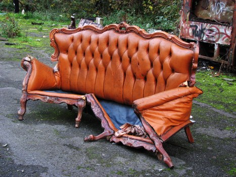 A Camden street with skip and recycling bins